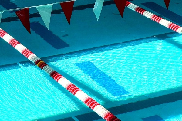 A close-up of red and white lane dividers in the pool at Rosen Aquatic & Fitness Center.