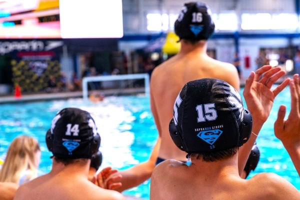 The backs of heads of several after-school student swimmers at RAFC.